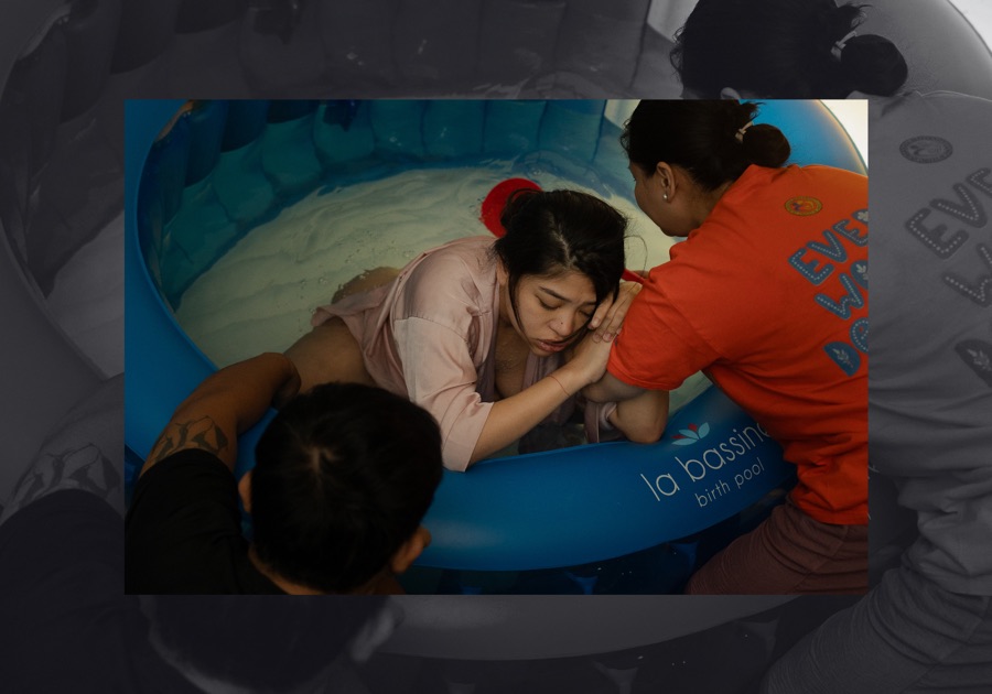 A mother receiving hands-on support during waterbirth
