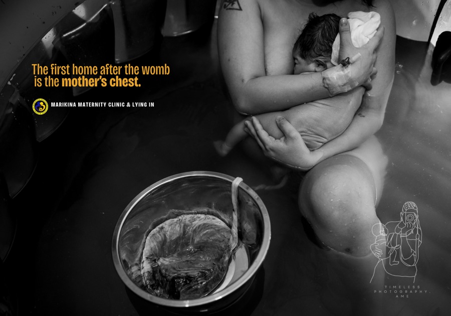 A newborn resting close to their mother